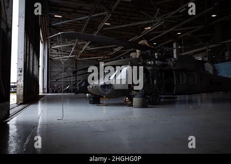 Aircraft maintainer with 4th Battalion, 3rd Aviation Regiment works on UH-60 Black Hawk on Hunter Army Airfield, Aug. 2. Stock Photo