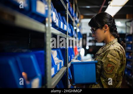 U.S. Air Force Staff Sgt. Angela Martinez, the 354th Civil Engineering Squadron (CES) noncommissioned in charge of material control, checks inventory on Eielson Air Force Base, Alaska, Aug. 5, 2021. As operations manager by trade, Martinez is responsible for maintaining the warehouse materials which are used to help repair and sustain the base. Stock Photo