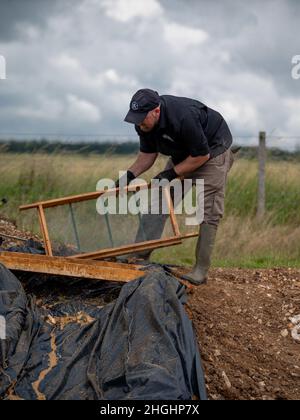 Gregory Ashcroft squad lead for the American Veterans Archeological Recovery group searches for remains of fallen