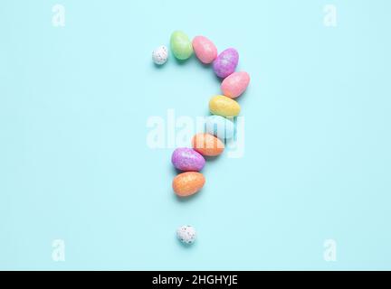 Question mark made of decorative eggs on color background Stock Photo