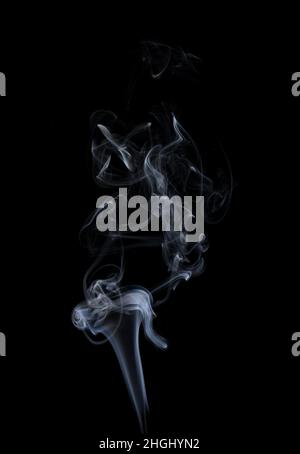 Smoke on black background. White smoke on a black background. Stock Photo