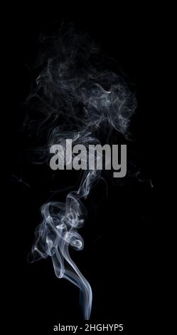 Smoke on black background. White smoke on a black background. Stock Photo