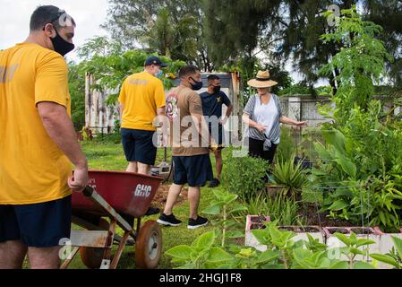 DEDEDO, Guam (Aug. 10, 2021) - Sailors from USS America (LHA-6) get to work at the Island Girl Power (IGP) community garden in Dededo, Aug. 10. Service members assisted with gardening and rehabilitation projects at the non-profit organization, which provides prevention and enrichment programs to young girls and teens in a safe, empowering, and positive environment. Juanita Blaz, IGP executive director, credited service members with the completion of many of the organization’s large-scale projects. “I love working with [military] volunteers. You really get to know the individual people and know Stock Photo