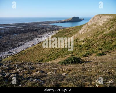 Worm's Head on the Gower Peninsula, Swansea, Wales taken from the mainland in Winter. Stock Photo