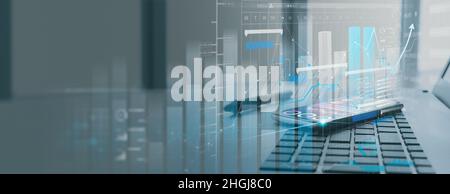 Office business workplace with laptop and smart phone and stylus showing virtual innovaton business management dashboard. Stock Photo