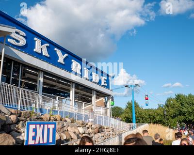 FALCON HEIGHTS, MN - 23 AUG 2019: The Sky Ride sign for an aerial cable ride with colorful gondolas at the Minnesota State Fair. Stock Photo