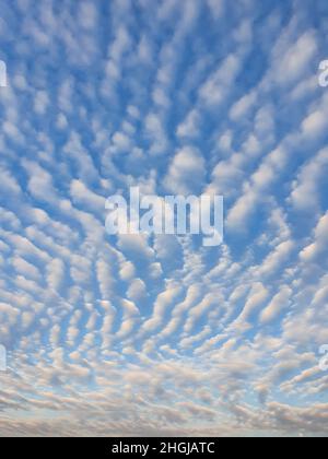 Abstract cloudscape scene. Beautiful sky background with fluffy clouds texture. Marvelous aerial composition, overcast shapes and patterns. Air freshn Stock Photo