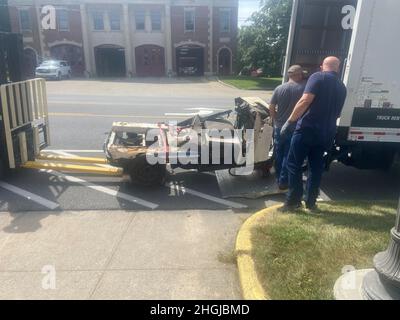 A New York Police Department parking enforcement vehicle which was crushed when the Twin Towers of the World Trade Center collapsed in Manhattan after jet liners were crashed into them by hijackers, is unloaded outside the New York State Military Museum in Saratoga Springs New York on August 16, 2021. The vehicle, on loan from the New York State Museum, will be part of an exhibit at the museum, run by the New York State Division of Military and Naval Affairs,  on the events of Sept. 11, 2001. Stock Photo