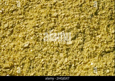 A Yellow Pile of Sulfur Produced in an Industrial Facility Stock Photo