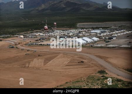 Area photo of the progression of Dona Ana Housing Area near Fort Bliss, Texas, Aug. 22, 2021. The Department of Defense, in support of the Department of State, is providing transportation and temporary housing in support of Operation Allies Refuge. This initiative follows through on America's commitment to Afghan citizens who have helped the United States, and provides them essential support at secure locations outside Afghanistan. Stock Photo