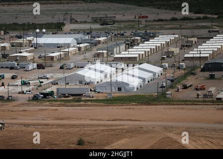 Area photo of the progression of Dona Ana Housing Area near Fort Bliss, Texas, Aug. 22, 2021. The Department of Defense, in support of the Department of State, is providing transportation and temporary housing in support of Operation Allies Refuge. This initiative follows through on America's commitment to Afghan citizens who have helped the United States, and provides them essential support at secure locations outside Afghanistan. Stock Photo