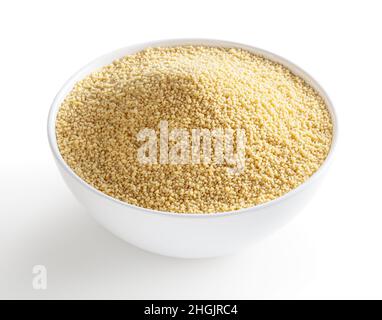 Uncooked dried cous cous in white bowl isolated on white background with clipping path Stock Photo
