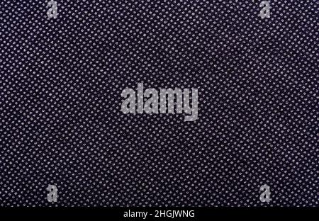 Background made of fabric with small dots and lines. Texture. Material for tailoring. Pattern of dense dark fabric Stock Photo