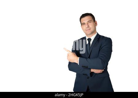 Businessman with his arms crossed and pointing his finger to the side with a smiling face. Salesman showing something good Stock Photo