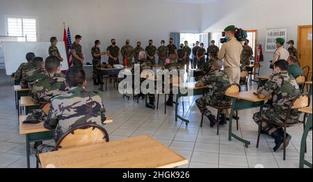 U.S. Marines, Sailors, and members of the Utah guard introduce themselves to the soldiers of the Royal Moroccan Armed Forces (FAR) near Kenitra, Morocco, Aug. 30, 2021. The focus of the Humanitarian Mine Action course is to implement a train-the-trainer period of instruction that develops the FAR’s skills in order to train their own personnel in preparation for future operations. Stock Photo