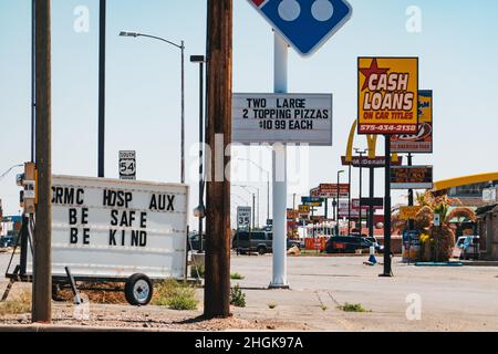The main street littered with fast food and loan signage in Alamogordo, New Mexico, United States Stock Photo
