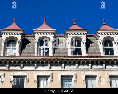 Closeup of slate shingles, detailed gables on a mansard roof and dentil molding in historic Charleston, South Carolina. Stock Photo