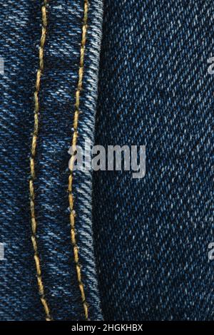 Seams on jeans close-up. Stitching on denim. Close up of blue jeans background. Denim texture. Stock Photo
