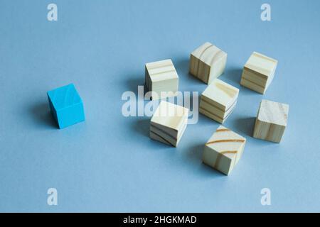 Group of wooden blocks and one different block. Different opinion, direction, idea, innovation concept Stock Photo