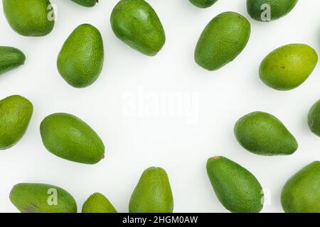 Avocados frame on white background. Flat lay, top view. Food concept. Stock Photo