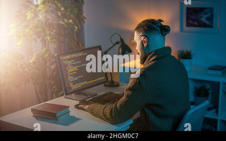 Man using pc for coding Stock Photo