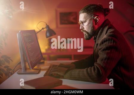 Man using pc for coding Stock Photo