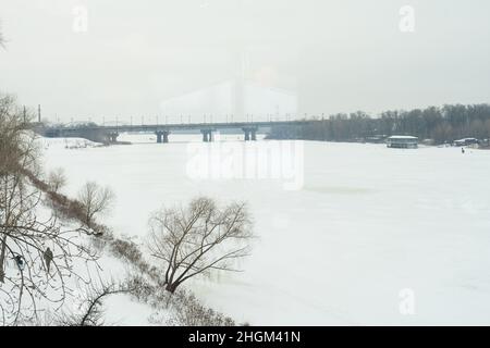 Panoramic view on Kiev Monastery of the Caves in winter. River, Church of the Nativity of the Virgin Mary, Bell tower at the Far Caves. Stock Photo