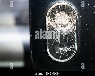 Close up shoot of broken mobile phone camera. shoot on black background Stock Photo