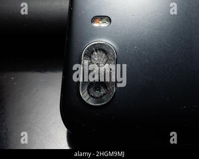 Close up shoot of broken mobile phone camera. shoot on black background Stock Photo