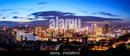 Panoramic skyline and modern commercial buildings in Chongqing at night, China. Stock Photo
