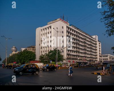 MUMBAI, INDIA - November 26, 2021 : Churchgate station,  the southern terminus on the Western Line of the Mumbai Suburban Railway and local taxis in M Stock Photo