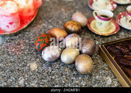 Painted Easter eggs, multicolored, vintage, on a wood table Stock Photo