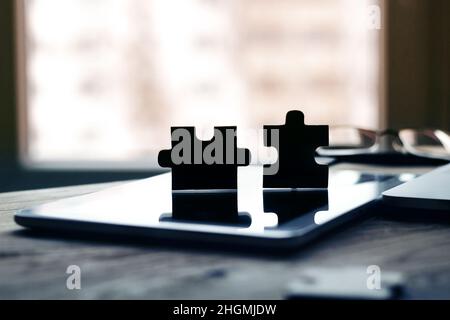 business concept - pieces of puzzles on the modern workplace of the office Stock Photo
