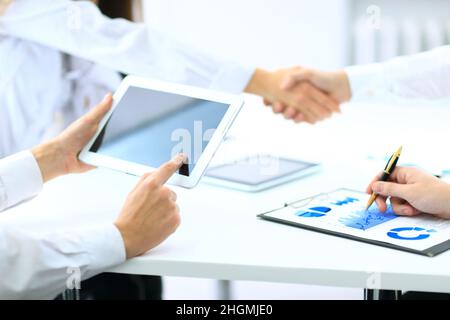 transaction was completed. businessmen shake hands. Stock Photo