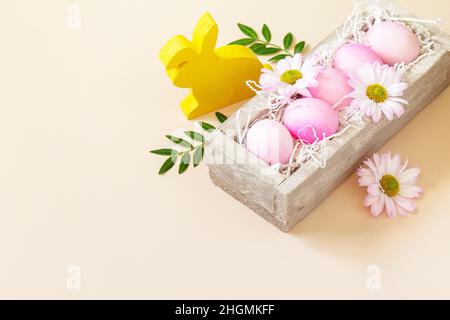 The minimum concept of Easter. Easter Eggs painted pink eggs on trendy pastel background. Copy space. Stock Photo