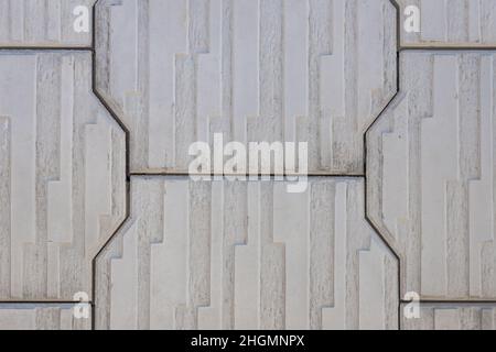 Close-up of a street gray polygonal tile with raised details. Tile pattern Stock Photo