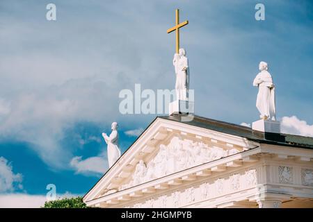 Vilnius Lithuania. Close Pediment Of Cathedral Basilica Of St. Stanislaus With Three Statues On Top Stock Photo