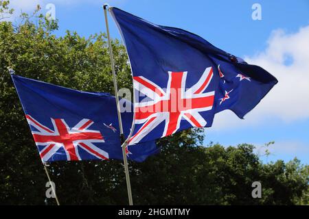 Christchurch, New Zealand. 22nd Jan, 2022. Inverted New Zealand flags were numerous during the antivax protest in Cranmer Square. Protesters take to the streets in the affluent suburb of Merivale in protest against the mandatory Covid19 vaccination. Credit: SOPA Images Limited/Alamy Live News Stock Photo