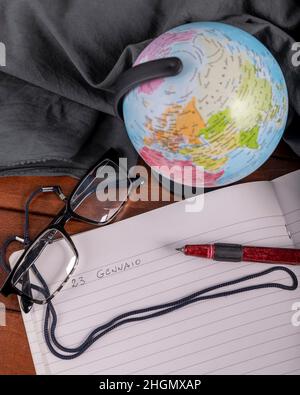 A pen wrote on a white lined paper January 23 in Italian to celebrate National Handwriting Day Stock Photo
