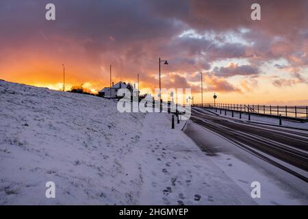 Herne Bay - a look west during the back-edge of a heavy snow shower that occurred before sunset. The beach and Sheppey can be seen coated in snow.