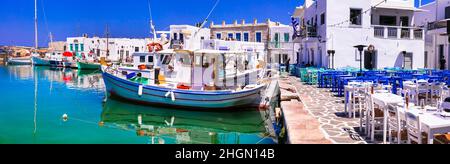 Greece travel. Cyclades, Paros island. Beautiful fishing village Naousa. Panorama of old port with traditioal street taverns Stock Photo