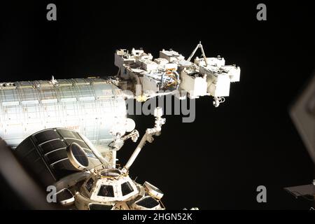 Washington DC, USA. 22nd Jan, 2022. NASA astronaut Kayla Barron peers out from a window inside the cupola, the International Space Station's 'window to the world' on January 9, 2022. Prominent station components in this photograph include the Kibo laboratory module and its external pallet, the Japanese robotic arm, and the Leonardo Permanent Multipurpose Module. Credit: NASA via CNP Credit: Abaca Press/Alamy Live News Stock Photo
