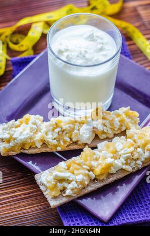 Diet sandwich. Bread jam with cottage cheese and fruits. Stock Photo