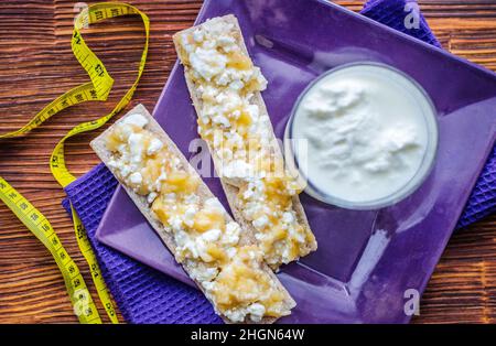 Diet sandwich. Bread jam with cottage cheese and fruits. Stock Photo