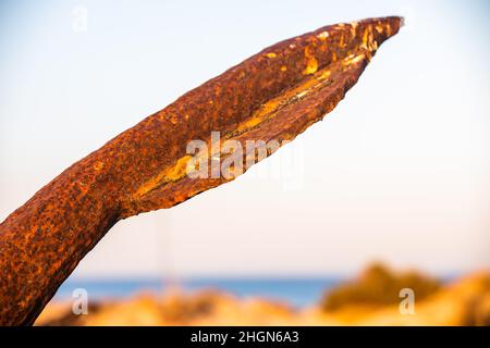 The arrangement of anchors memorial to the lost tuna fishing industry that once thrived there and were used to keep the nets in place as opposed to mo Stock Photo