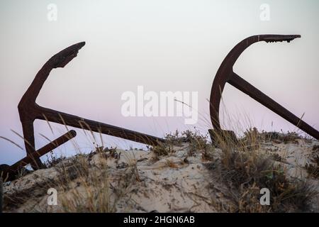 The arrangement of anchors memorial to the lost tuna fishing industry that once thrived there and were used to keep the nets in place as opposed to mo Stock Photo