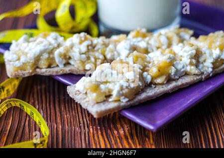 Diet sandwich. Bread jam with cottage cheese and fruits. Stock Photo