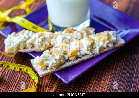 Diet sandwich. Bread jam with cottage cheese and fruits. Stock Photo