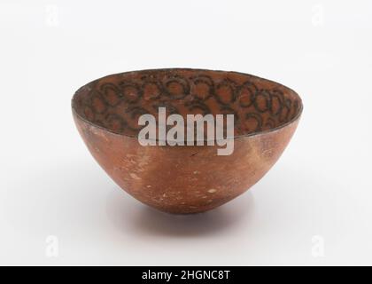 Bowl decorated with linked ibex horns ca. 5300-4300 B.C. Iran This hemispherical bowl with a ring base is made of a fine red clay. The inside is decorated with four registers of a repeating patter of curves suggesting the attenuated body of an ibex and its curved horns. The bowl was made by hand, and possibly finished on a slow wheel.This bowl comes from a site in the area of Tehran called Cheshmeh Ali, near a freshwater spring, where the earliest permanent settlement dates to 6000-5500 B.C. Excavations conducted at the site in 1934-1936 uncovered distinctive orange-reddish pottery painted wit Stock Photo