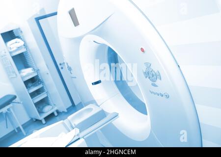 CT scan machinery with empty bed in the hospital room. Stock Photo